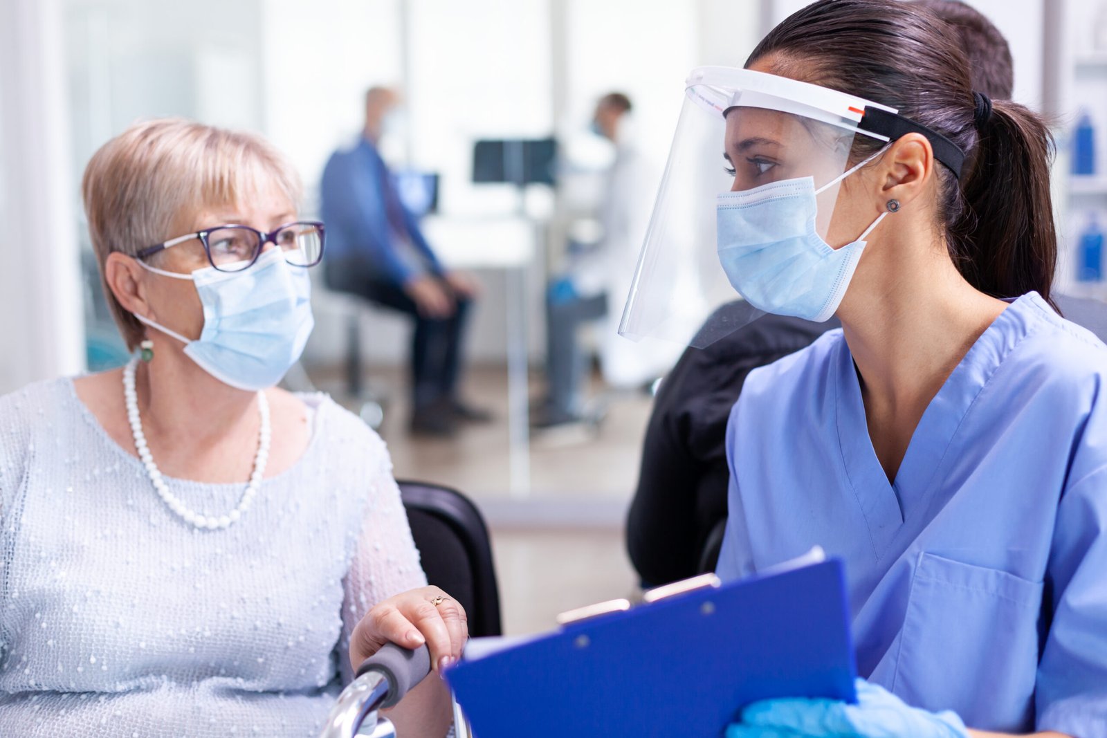 Medical staff with disabled woman